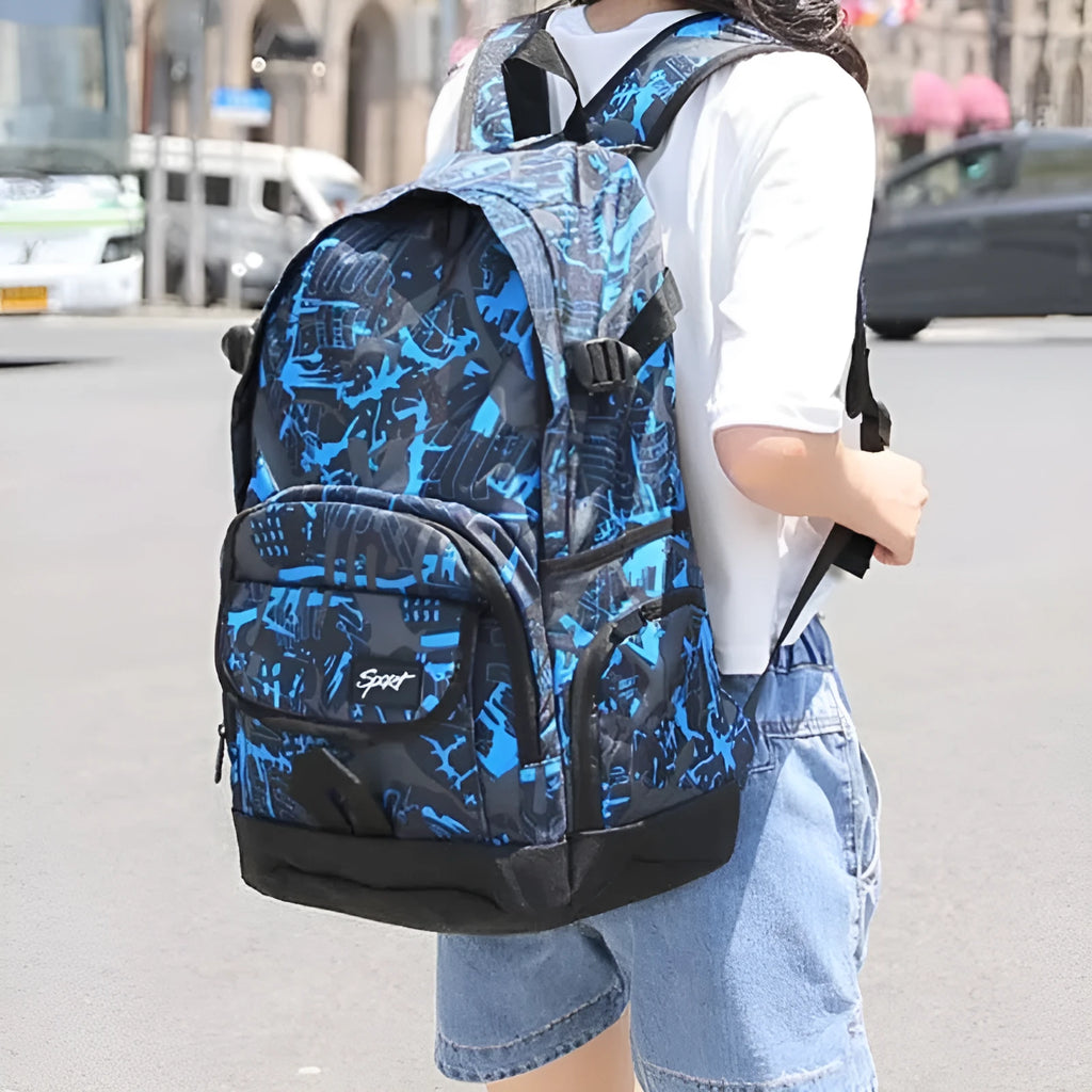 Blue and red versions of a classic nylon backpack with large main compartment and organisational pockets.