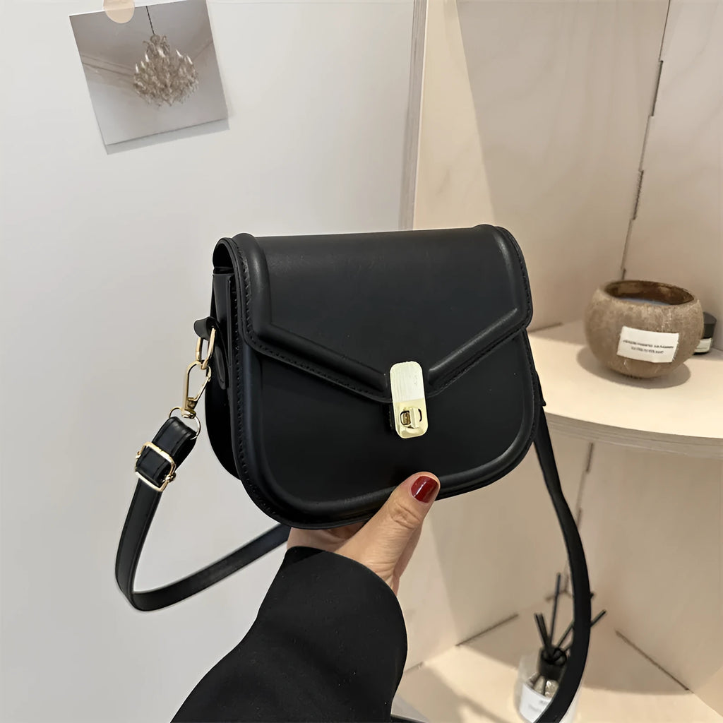 Soft textured PU leather messenger bag with clamshell opening in dark brown colour