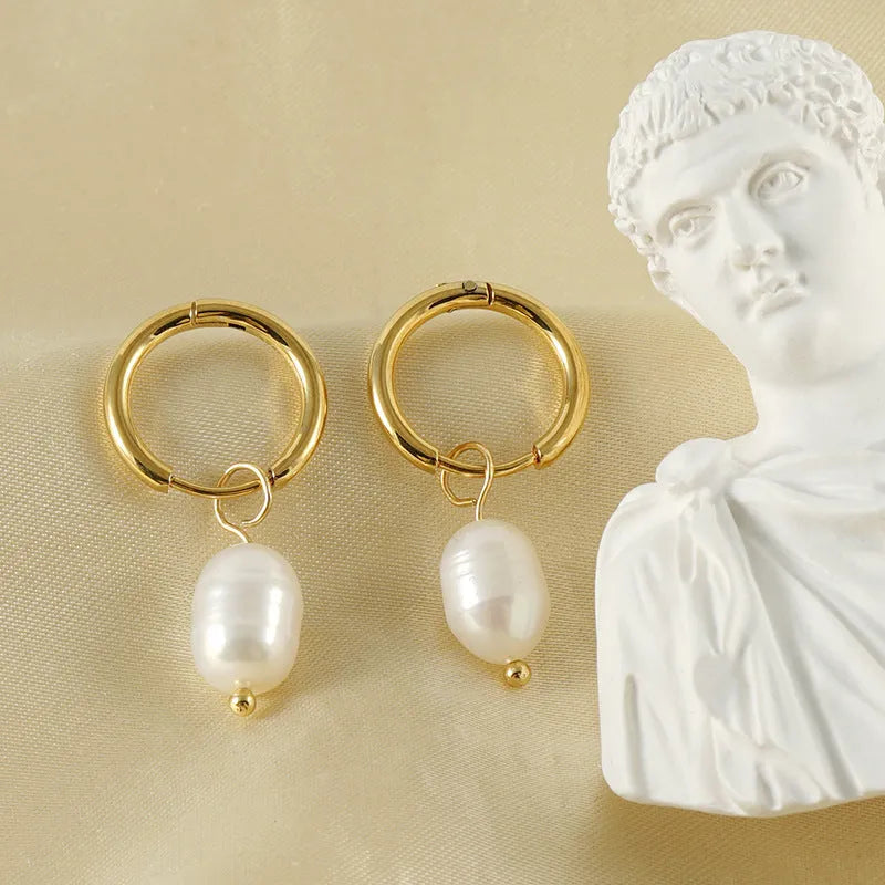 Geometric gold earrings with freshwater pearls on stainless steel posts