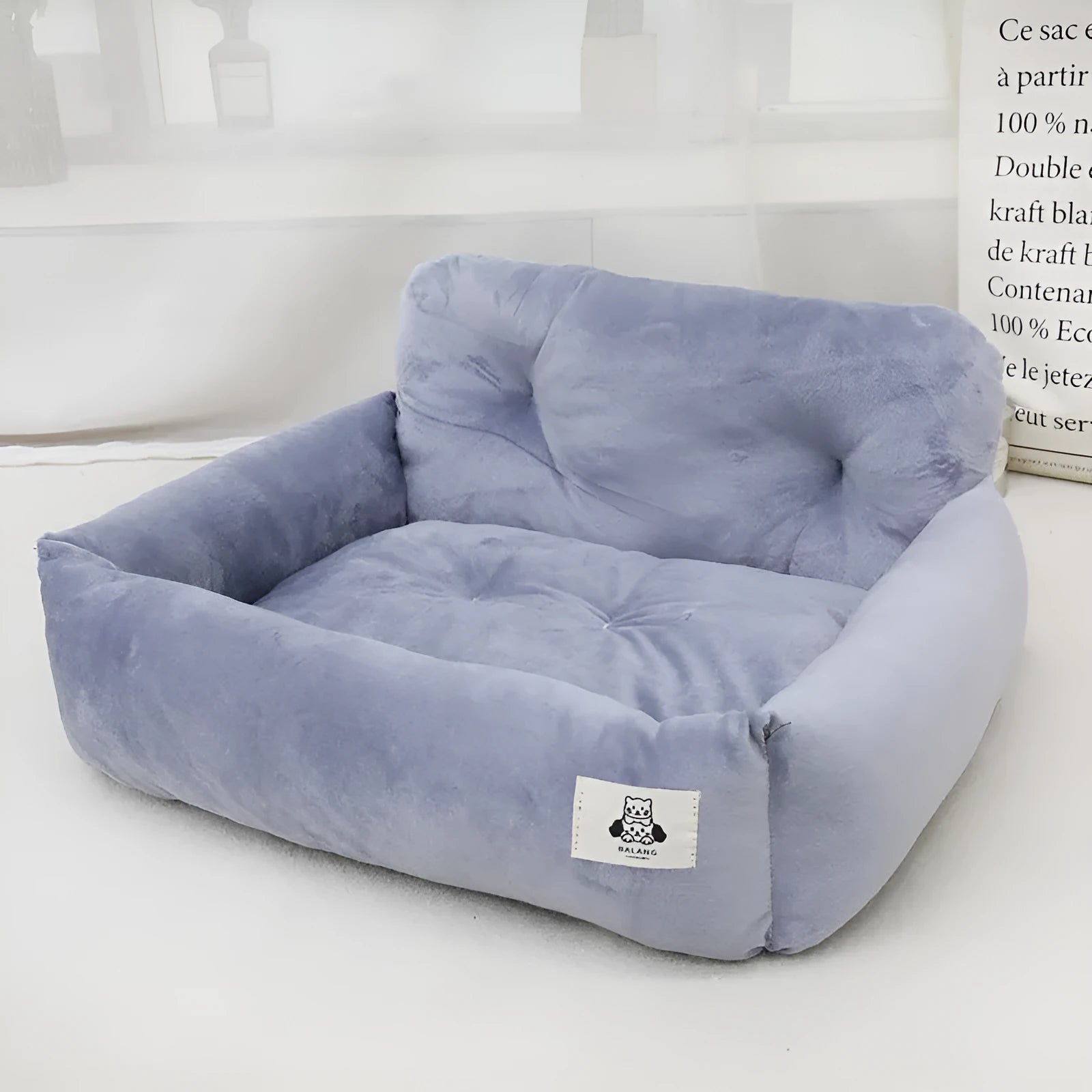 Grey and blue plaid stain-resistant fabric dog travel nests for car use, shown in small and large sizes.