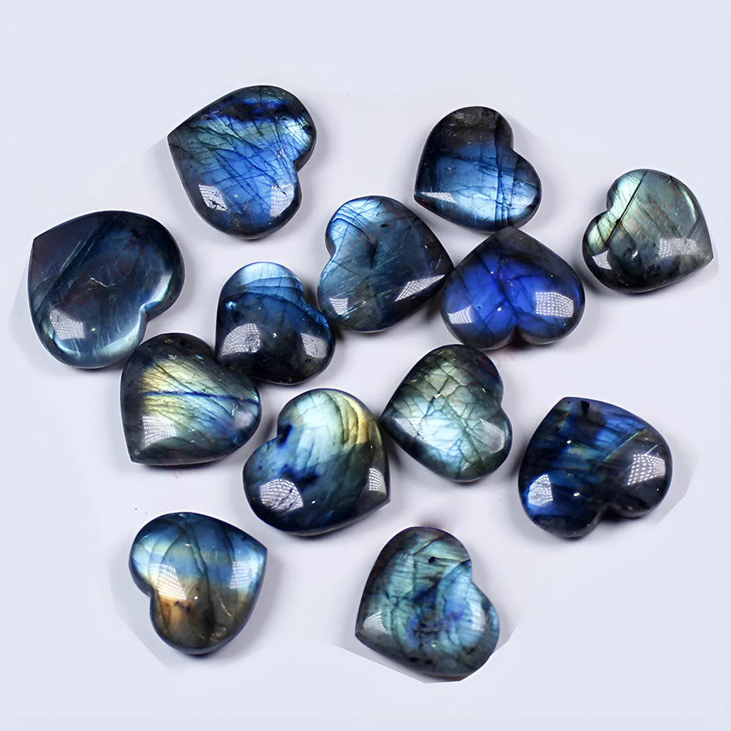 Natural pulled feldspar heart handle pendant in ocean blue moonlight colour on a white background.