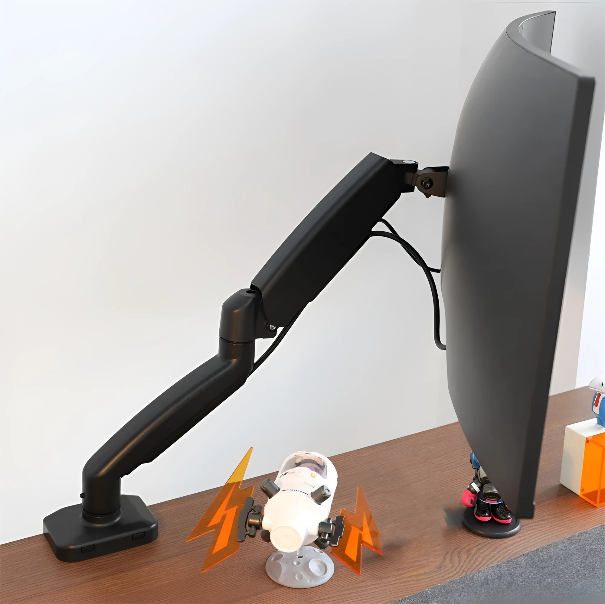 Black rotating telescopic LCD screen bracket with metal and aluminium construction on table