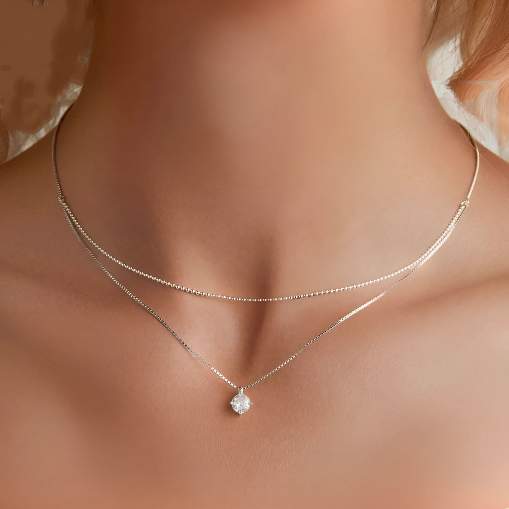 Women's double-layer sterling silver necklace with pearl chain design in silver colour