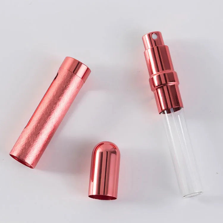 Slim 12ml aluminium travel perfume bottle with glass liner in choice of six colours including blue, gold, and pink.