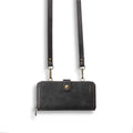 Black leather-style flip phone case with a detachable card wallet attached via strong adsorption.