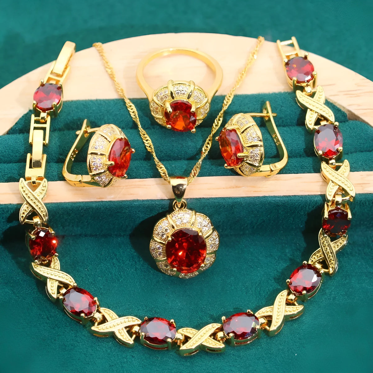 18k gold plated jewellery set with blue synthetic cubic zirconia stones, showing necklace, earrings, ring, and bracelet.