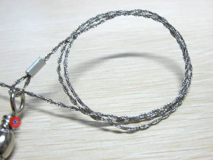 Stainless steel survival wire saw with pull rings showing 55cm cutting length