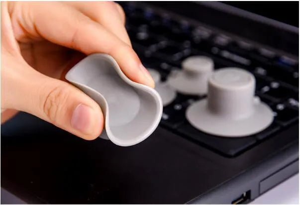 Grey plastic laptop cooling pad stand with large and small non-slip pads