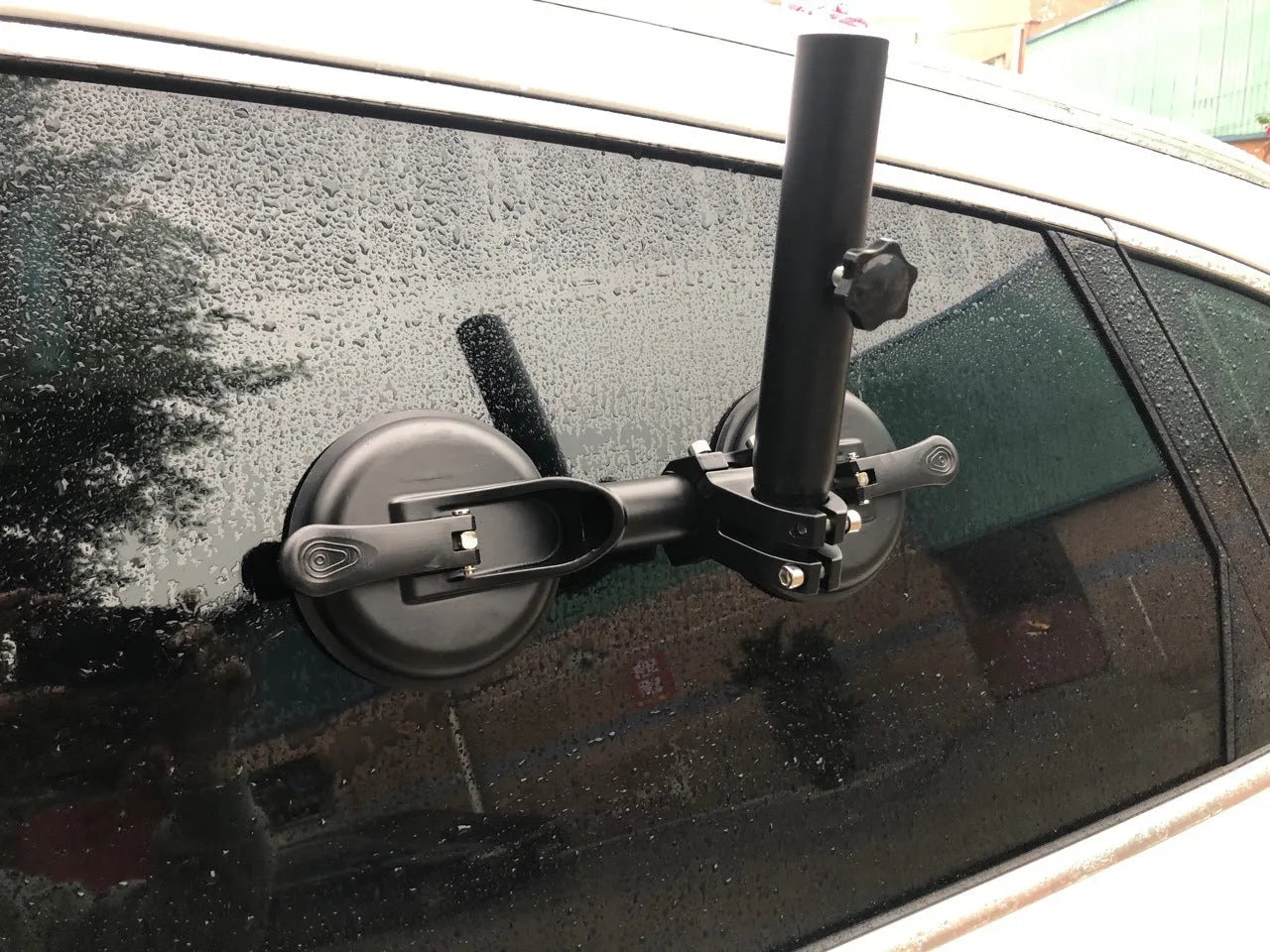 Black off-road car glass sucker mount with round rubber suction cup on ABS plastic base