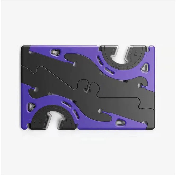 Plastic card type mobile phone holder in multiple colours on a desktop