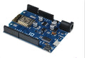 Black ESP-8266EX Wi-Fi development board with pin headers and onboard components.