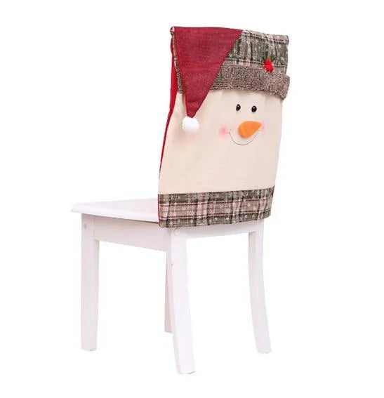 Set of red and white Christmas chair covers featuring Santa Claus, Snowman, and Santa hat designs on dining chairs.