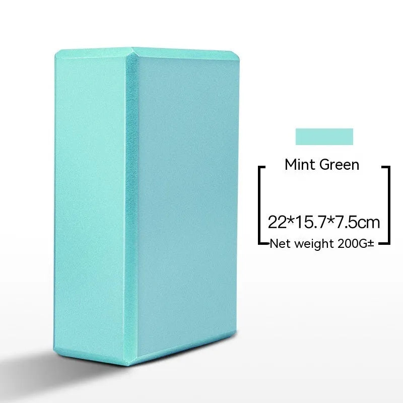 High-density EVA yoga block in mint green colour showing its rectangular shape and flat sides.