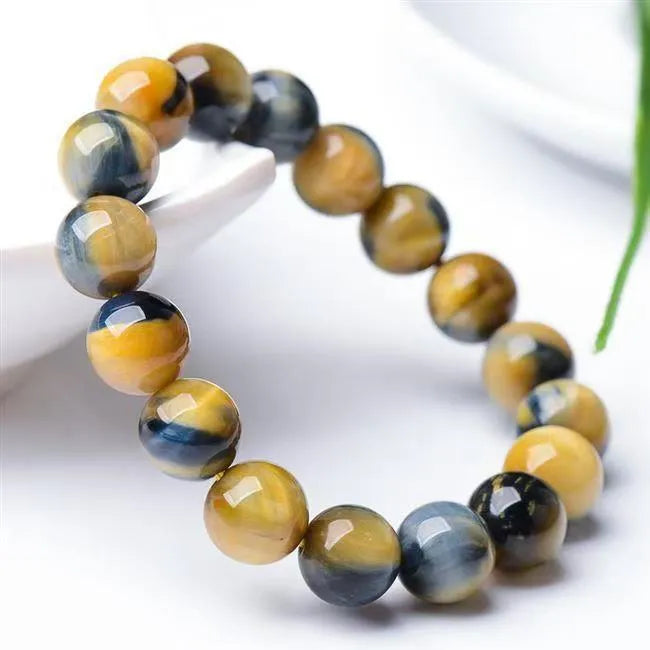 Natural fantasy tiger eye agate bracelet with round geometric beads on a wrist