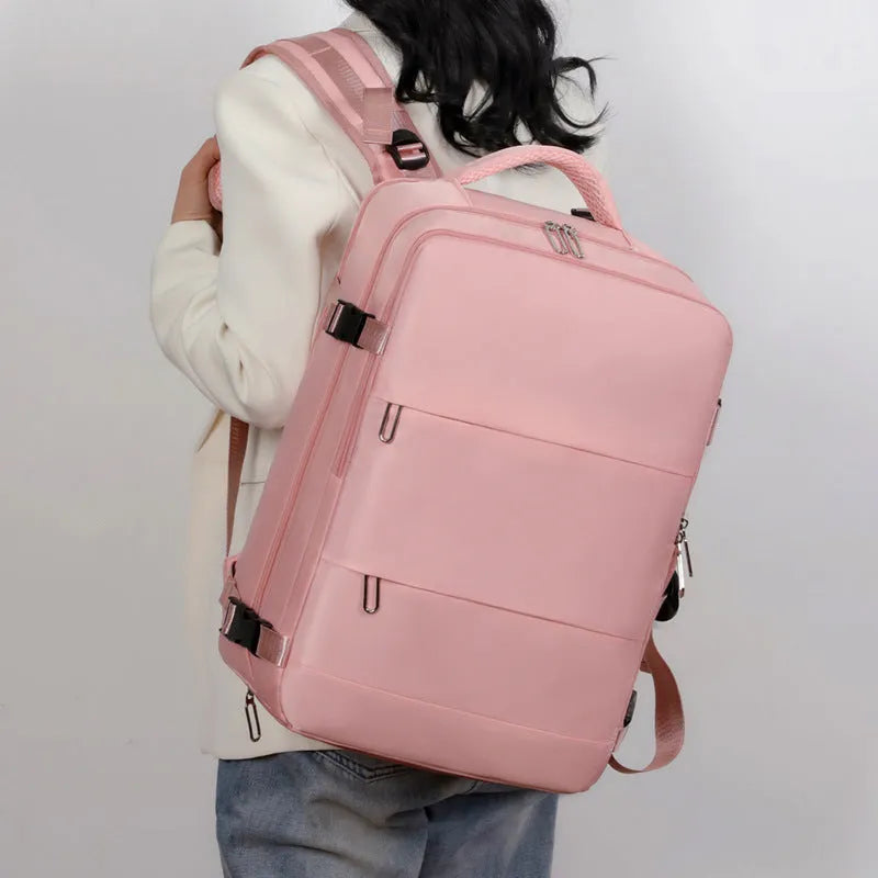 Large purple travel backpack for women showing multiple compartments and an air pillow belt system.