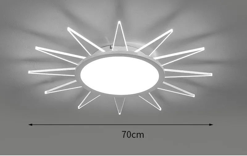 Modern circular aluminium LED ceiling lamp with remote control shown in room setting