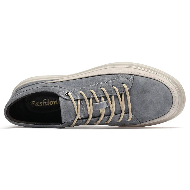 Grey and sand coloured low-top casual skate shoes with pigskin leather upper and rubber sole.
