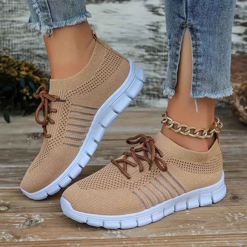 Women's black flying knit casual flat shoes with mesh upper and front tie lace.