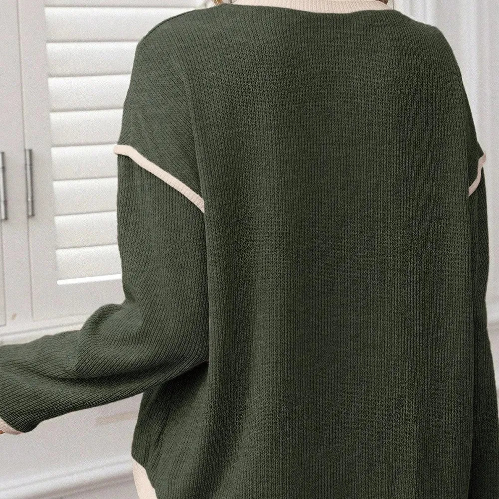 Drop shoulder loose knit top with four leaf clover pattern and contrast colour trim.