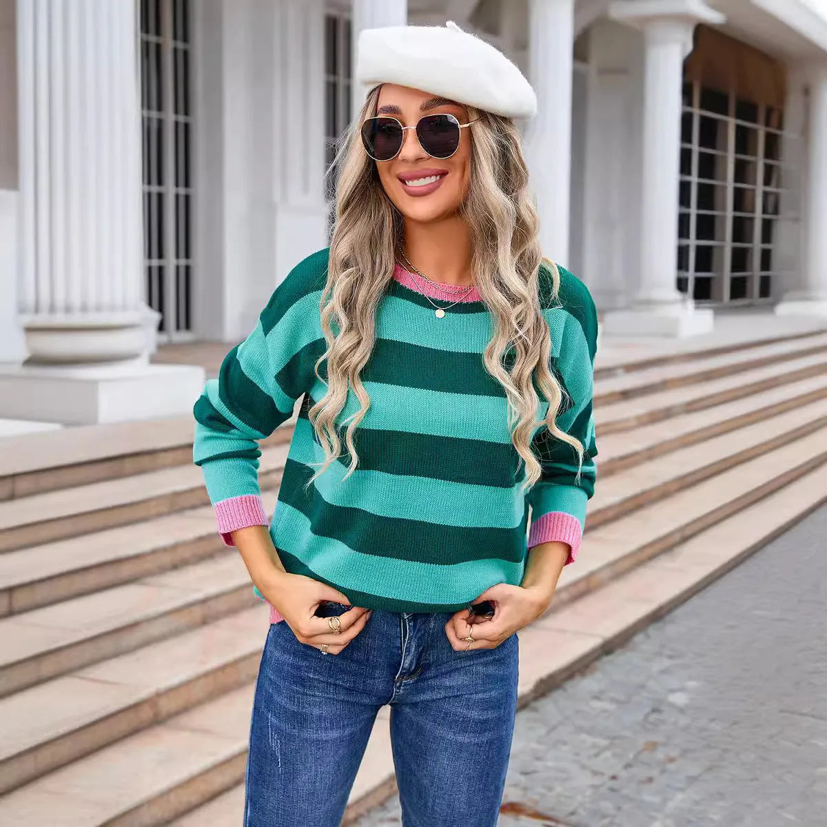 Women's loose long sleeve sweater in a striped pattern, shown in a blue colour option.