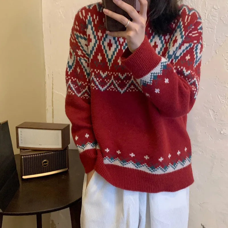 Red and white striped loose retro pullover knitted top with long sleeves on a hanger.