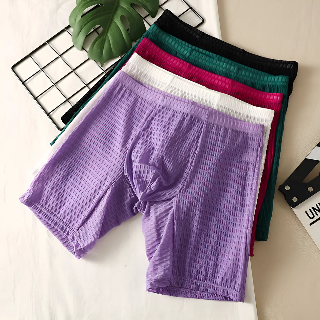 Men's solid colour lace boxer shorts with a lengthened hip lifting design on a size chart.