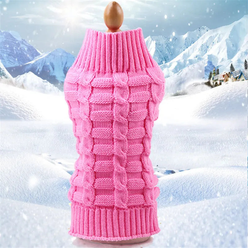 Dog wearing a wool twisted rope sweater in blue, pink, purple or red with size options from XS to XL.