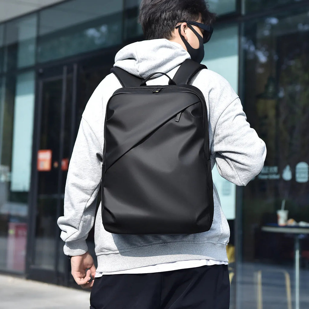 Large waterproof black PU backpack for men with computer compartment