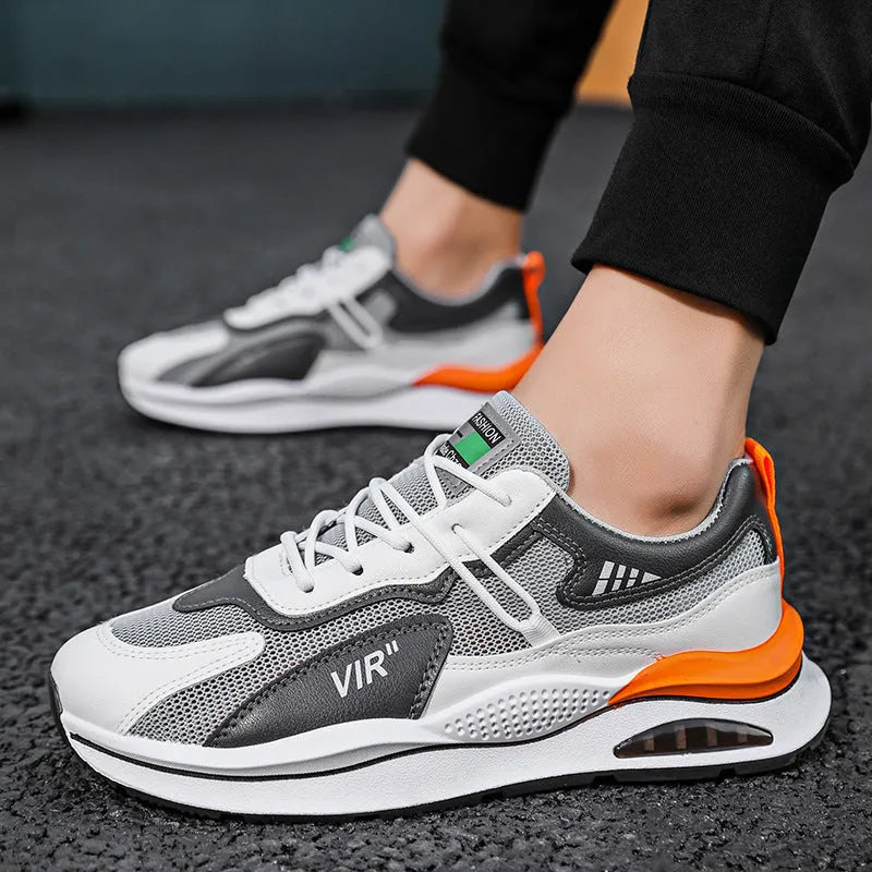 Men's gray mesh running shoes with round toe and middle top height on white background