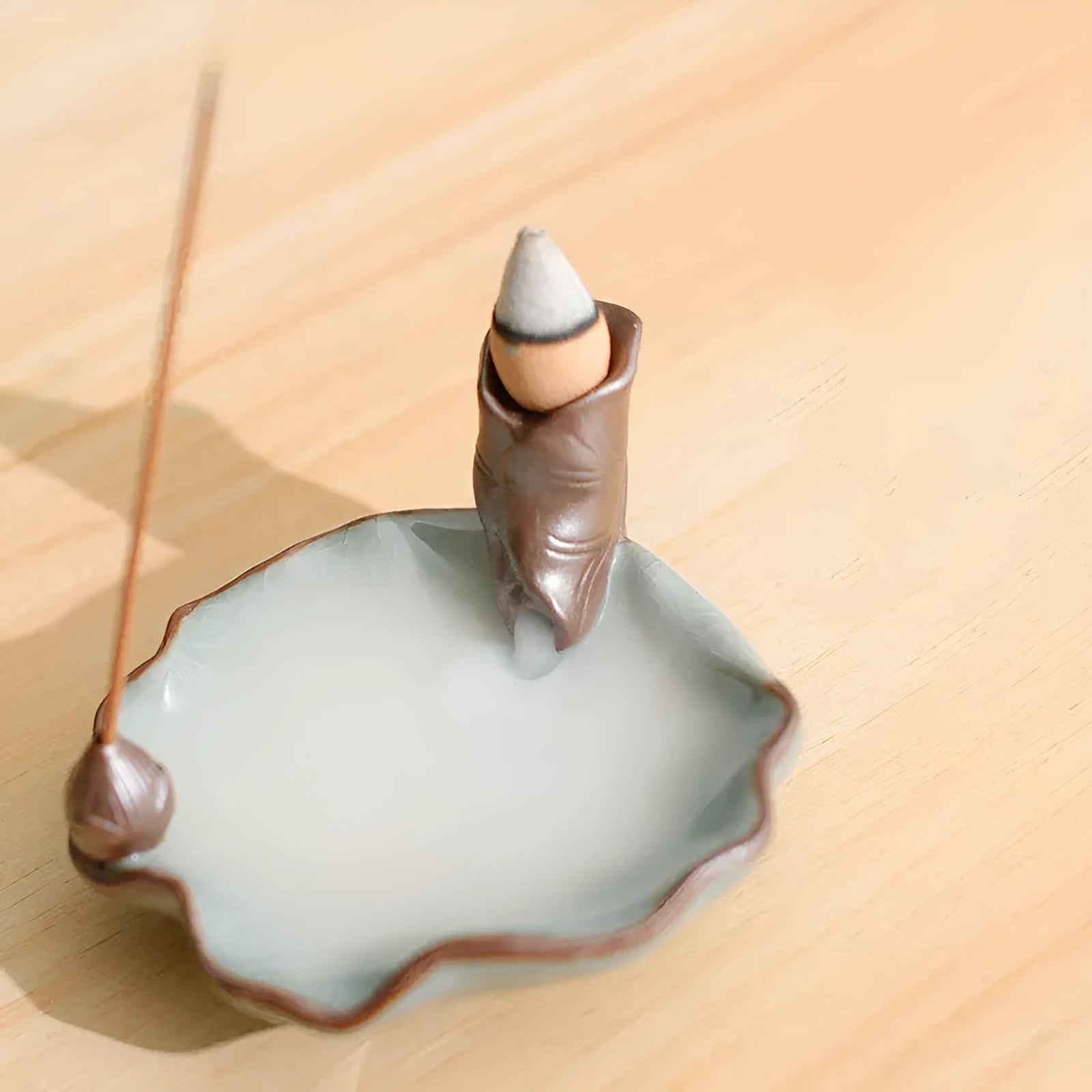 Square ceramic reverse flow incense burner with purple clay construction and lotus plum blossom decoration