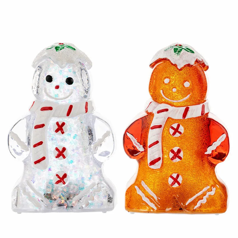 Set of four glowing plastic Christmas ornaments: gingerbread men and snowmen with red, white, and transparent scarves.