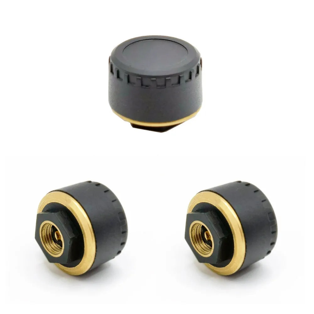 Four black Bluetooth tyre pressure monitors for mobile phone app display.