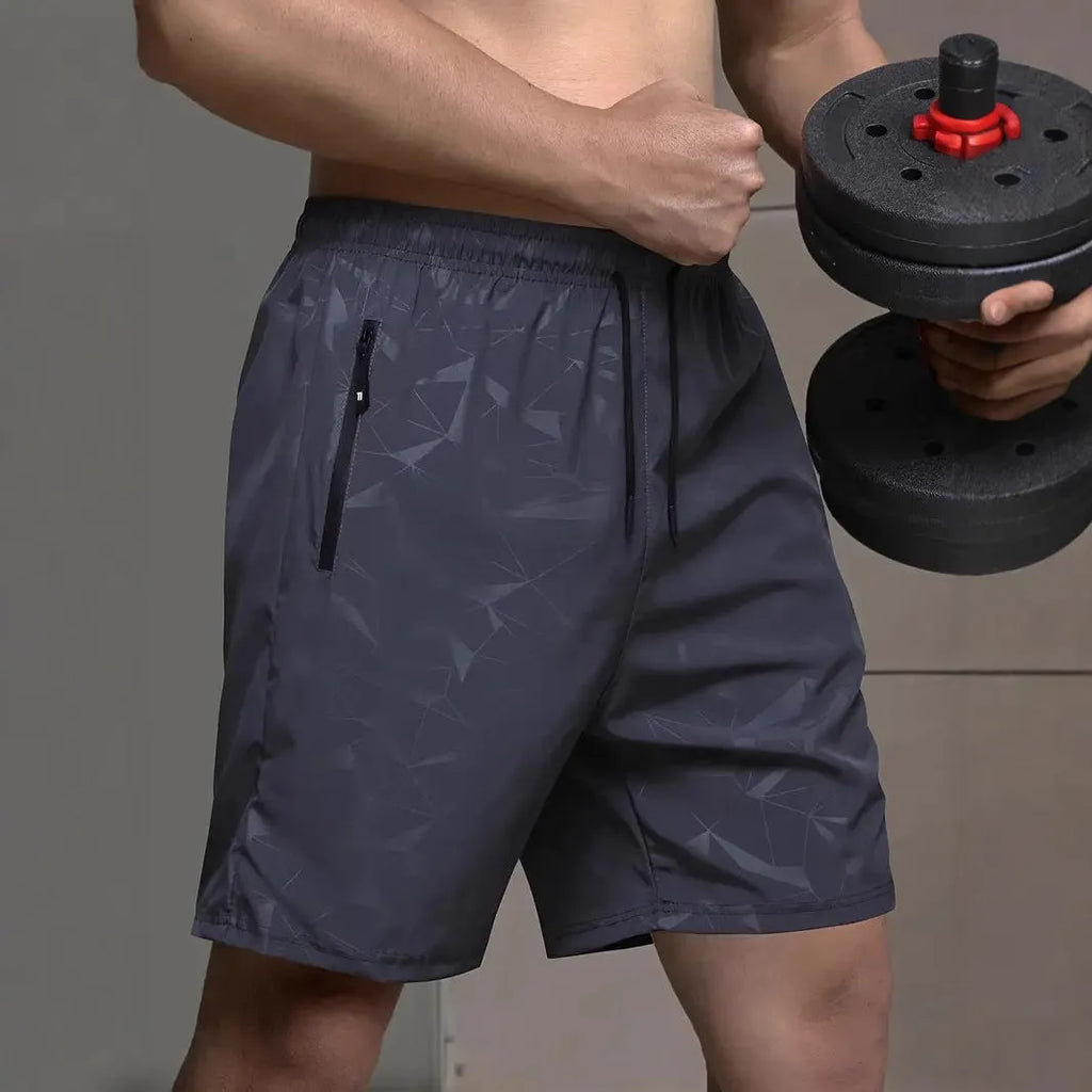 Men's loose fit polyester sports shorts with elastic waistband in black, grey, and blue colours