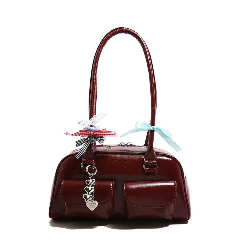 Retro one shoulder underarm pillow bag in PU leather with flap closure and double strap in black brown or red colour options