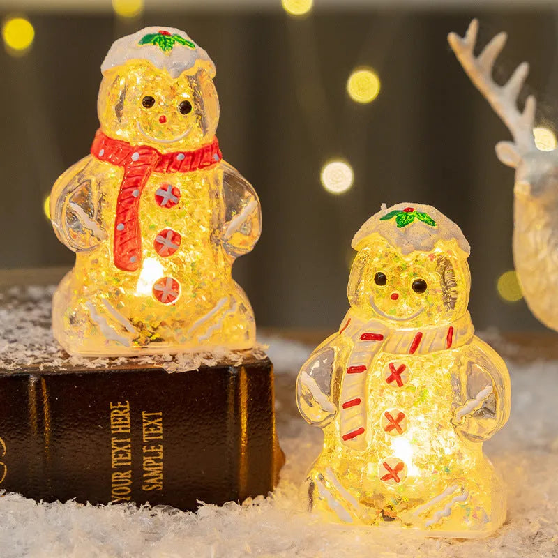 Set of four glowing plastic Christmas ornaments: gingerbread men and snowmen with red, white, and transparent scarves.
