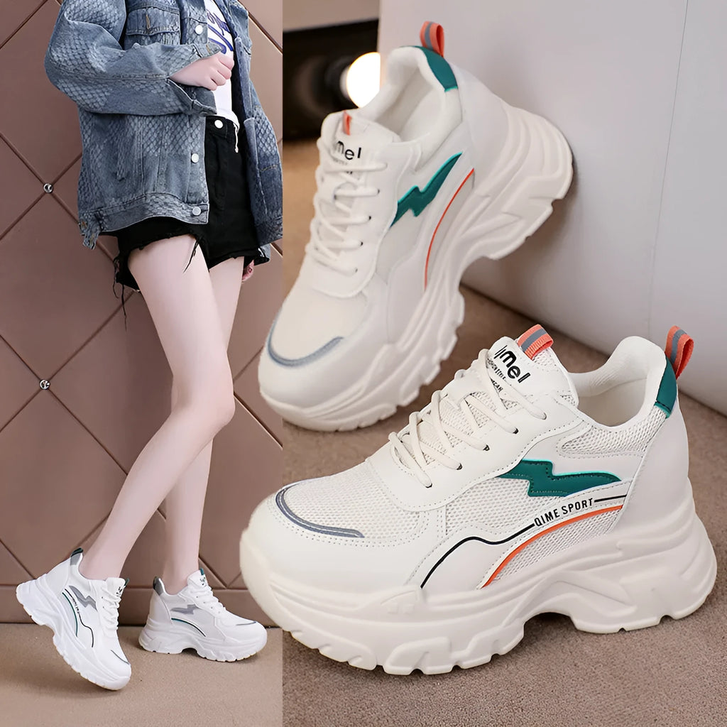 White women's dad shoes with cross shoulder straps and lace-up front on a rubber sole.