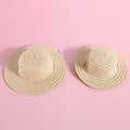 A colourful, handmade paper hat with a bowknot for a dog or cat on a white background.
