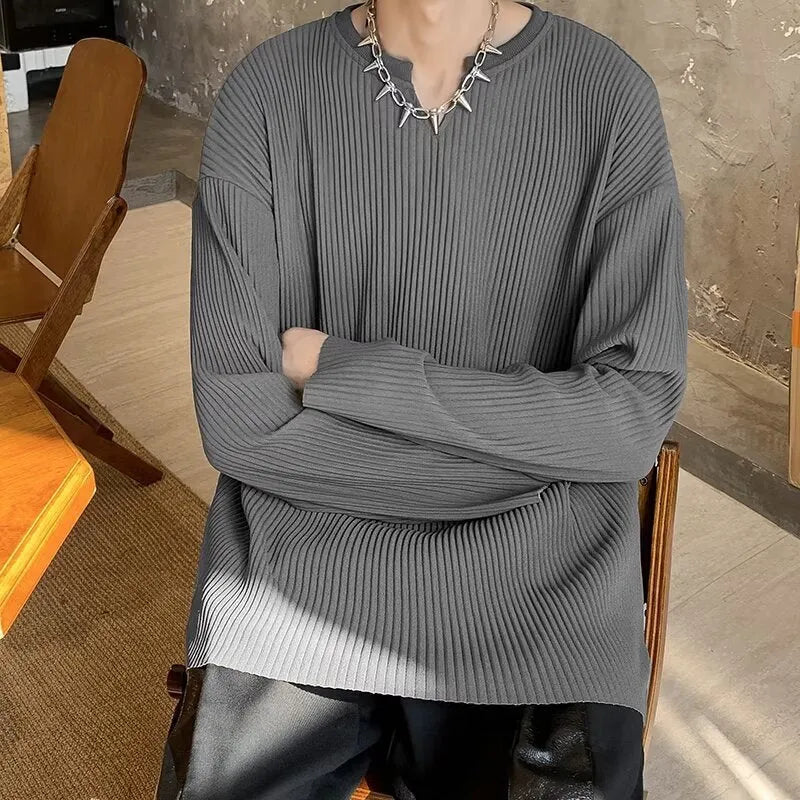 Plus size loose pullover top with striped texture and long sleeves in black colour