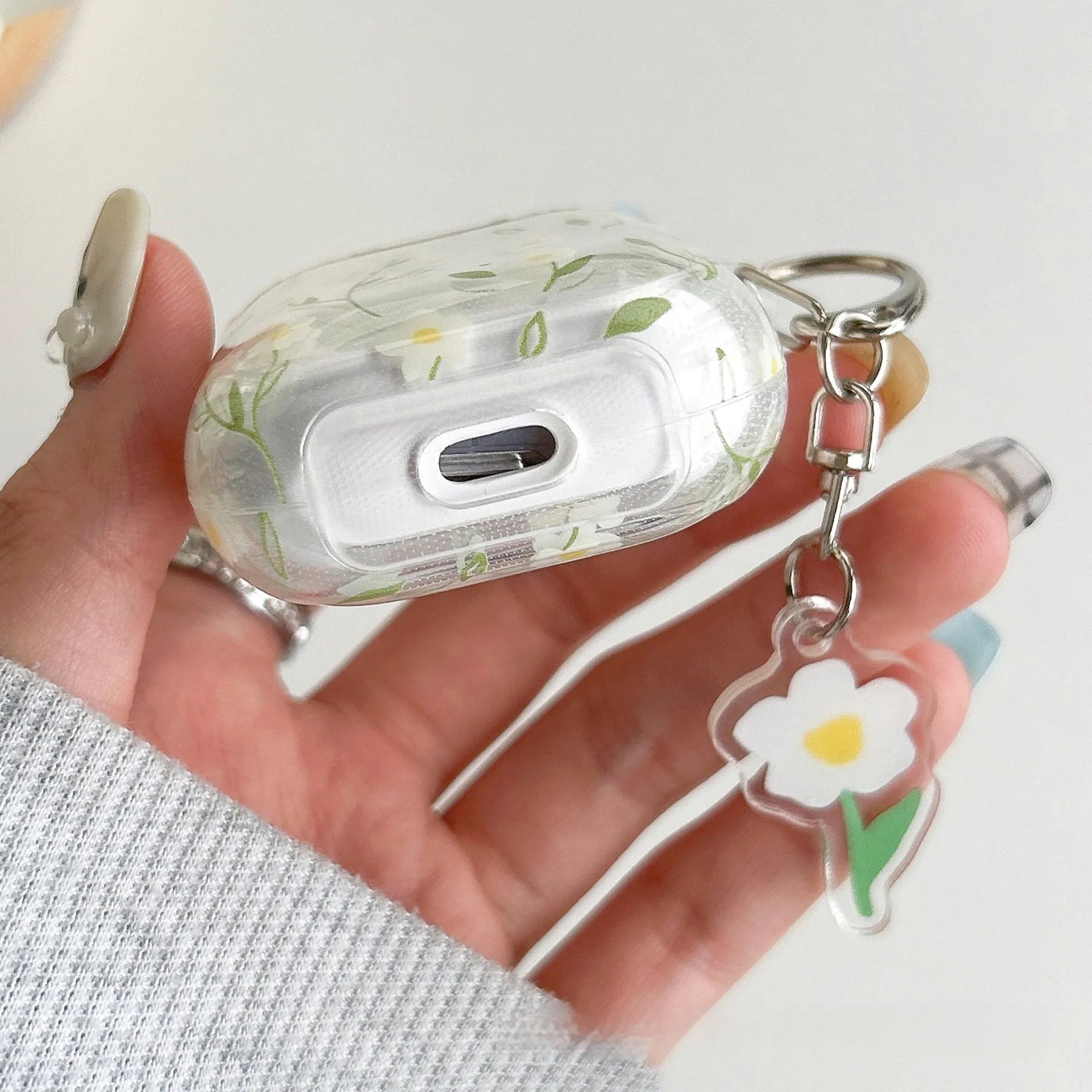 White floral pattern transparent TPU protective case for Apple AirPods showing soft shell design