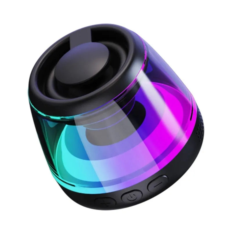 Black and white portable Bluetooth speaker with LED ambient lighting effects and magnetic base.