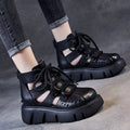 Women's black platform sandals with hollow hole design and fish-mouth toe, made from soft cowhide leather.
