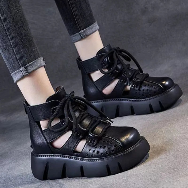 Women's black platform sandals with hollow hole design and fish-mouth toe, made from soft cowhide leather.
