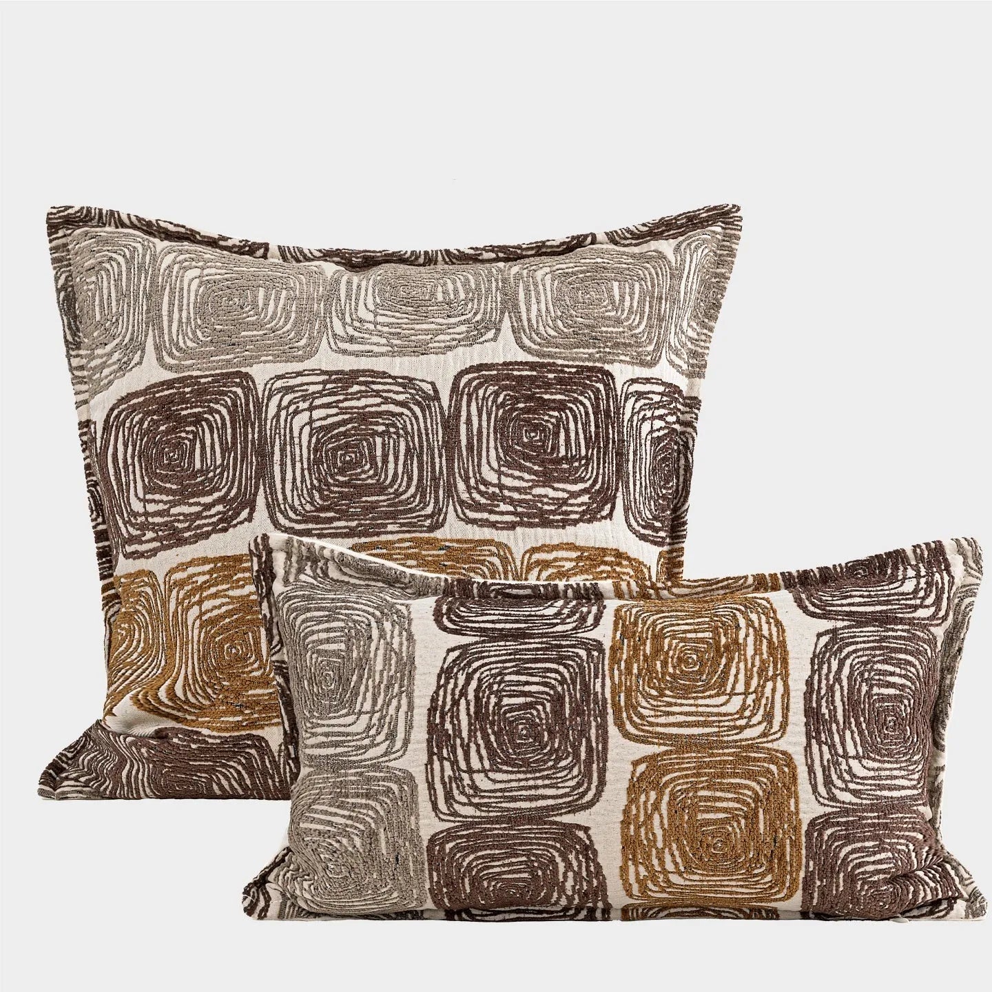Cream and coffee abstract coil pattern square pillow cover made from polyester feather velvet.