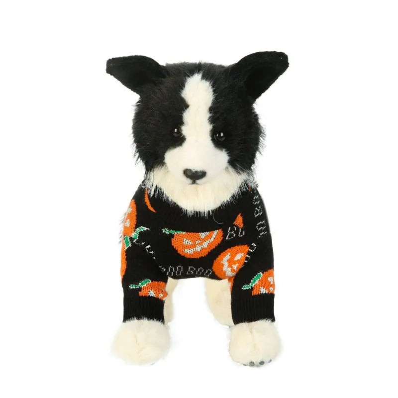 Black dog sweater with a large orange Halloween pumpkin print on the back.