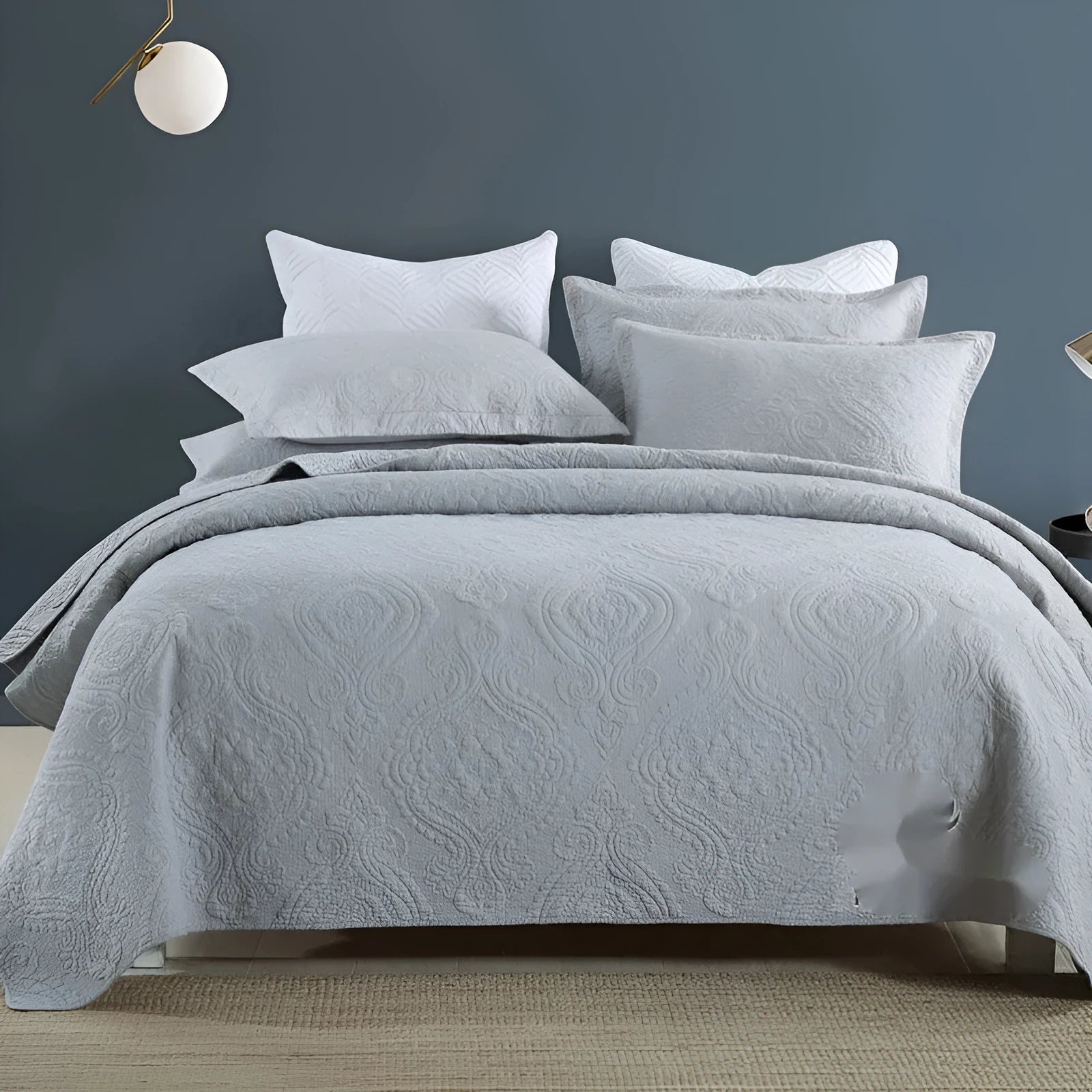 Pure cotton bedding set with damascus pattern showing embroidery details and quilted finish on bed