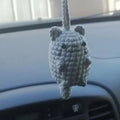 Plush hand-woven polyester car hanging ornament showing a cartoon character design.