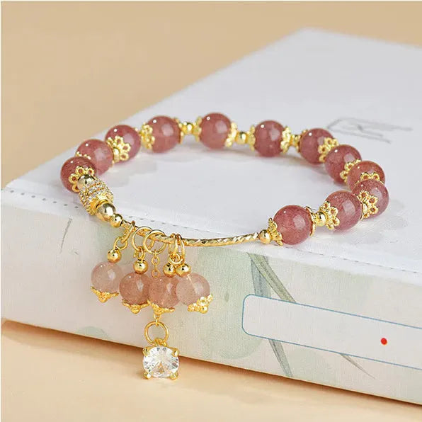 Pink women's bracelet with heart-shaped strawberry quartz crystal and pearl decorative elements