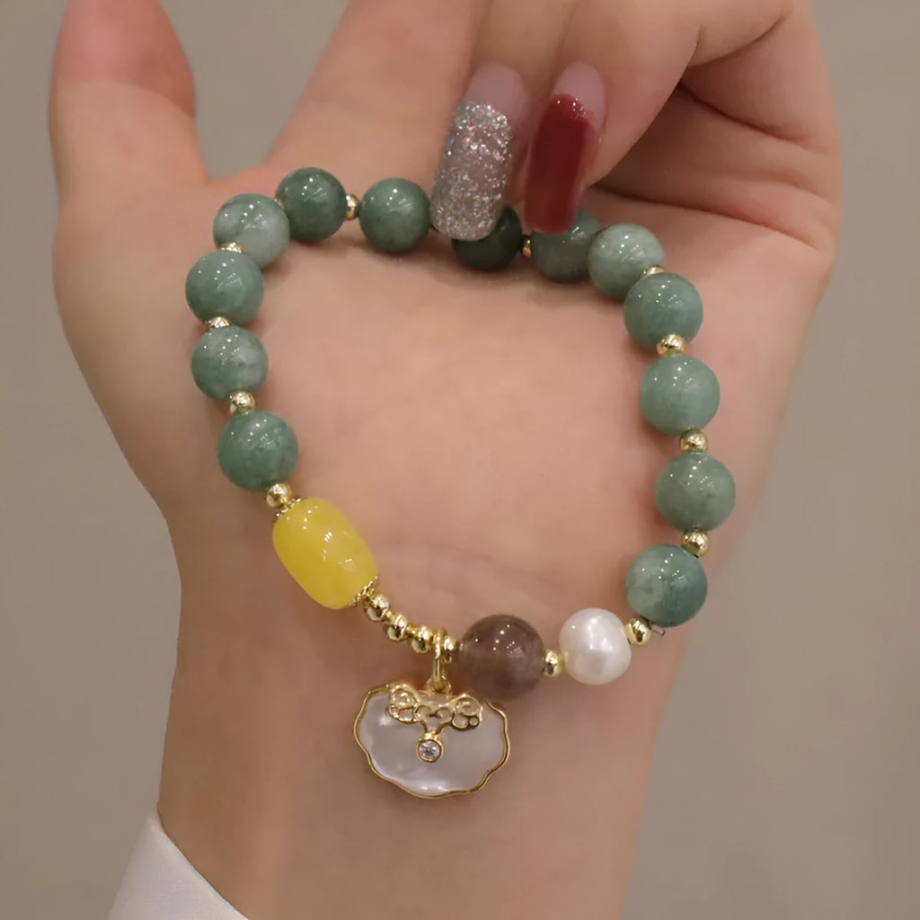 Natural green jade stretch bracelet with polished beads on wrist