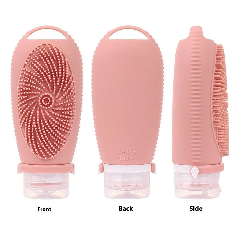 Silicone bath brush storage bottle in a choice of colours including pink and sea blue on a bathroom counter.