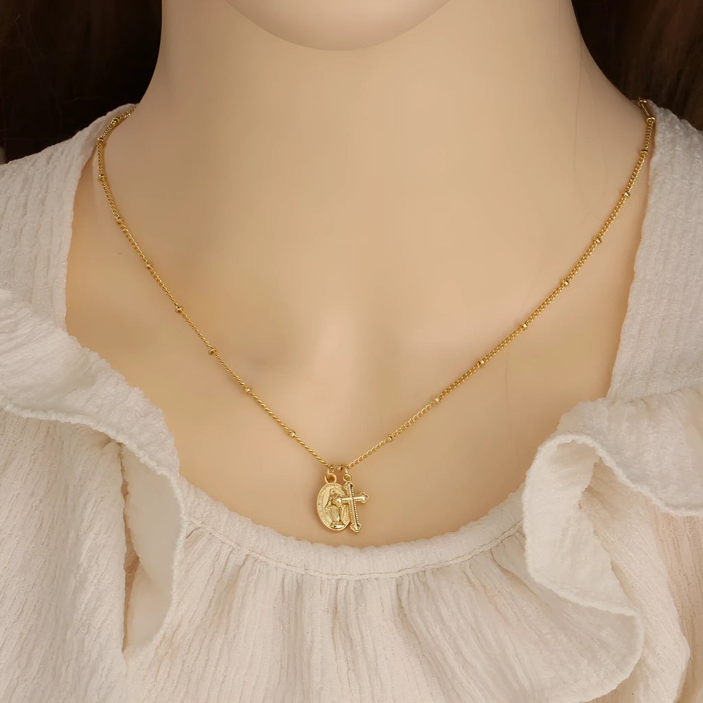 Golden Virgin Mary necklace with geometric cross pendant on copper chain